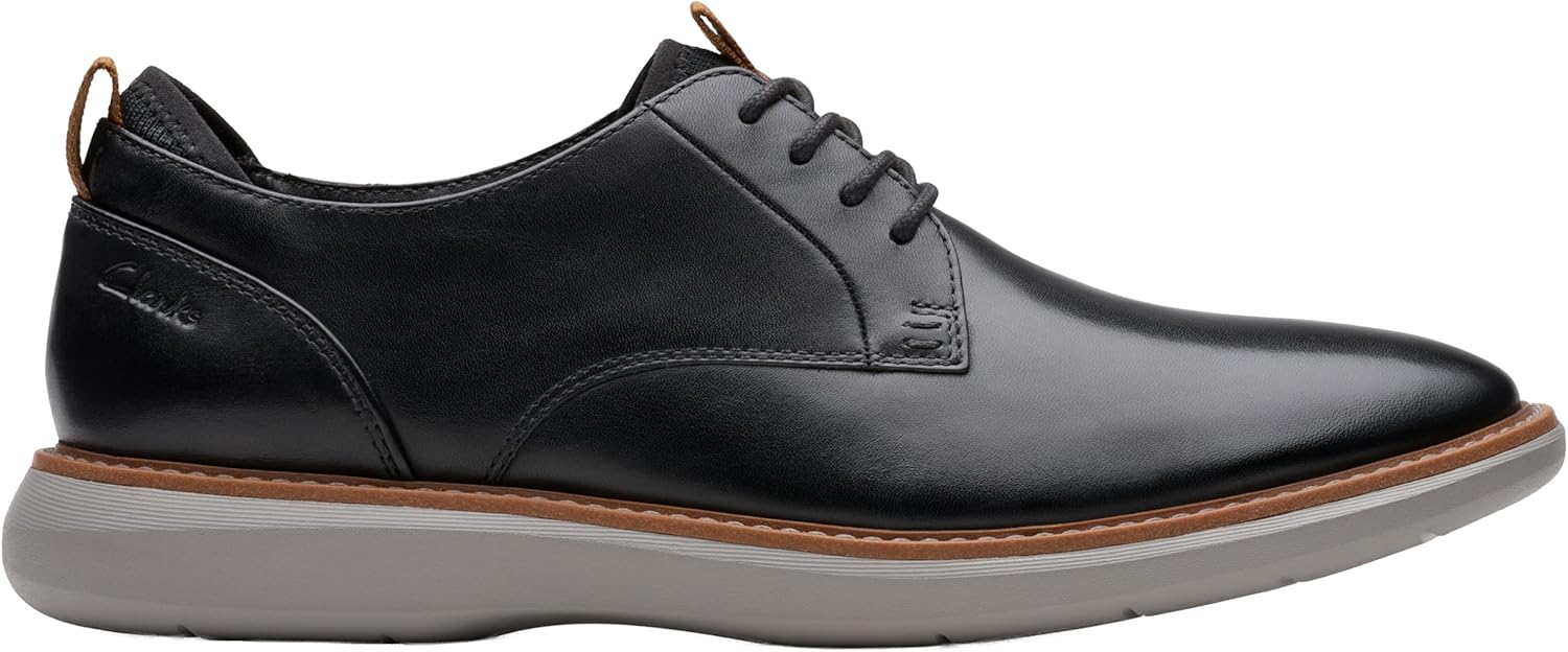 Pavo Monitor Arm installed on a wooden office desk